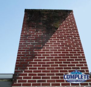 Dirty brick chimney before and after cleaning by Complete Power Wash